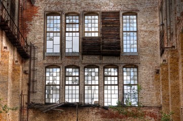 Old windows i a abandoned hall