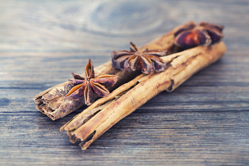 Star anise and cinnamon on a wooden background