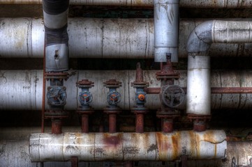 Old pipes with valves in an Lost Place