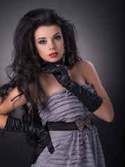 Fototapeta premium Portrait of young brunette girl in fashion style