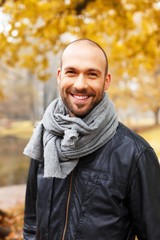 Positive middle-aged man alone outdoors 