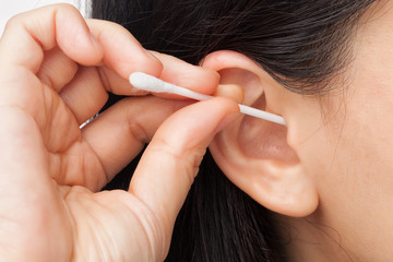 Woman cleaning ear