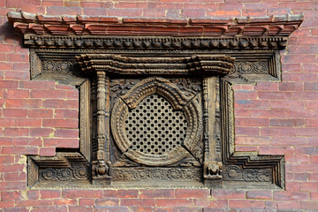Carved wooden window on the Royal Palace. Patan, Nepal