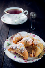 Croissant with jam and tea for breakfast