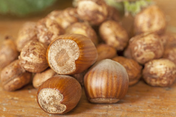 Hazelnut shells on wooden table top