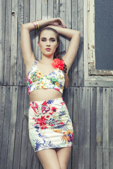 Naklejka premium fashion attractive girl, background timber wall