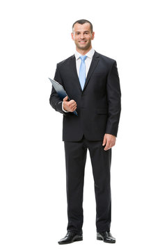 Full-length portrait of businessman handing folder