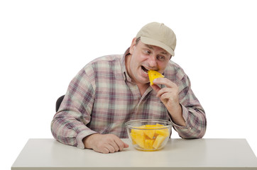 Mature man biting yellow watermelon