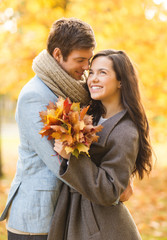 Fototapeta premium romantic couple kissing in the autumn park