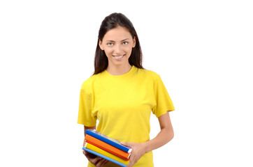 Beautiful student in yellow blouse holding books.