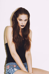 Fototapeta premium Glamour fashion against wall