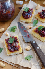 Toasts with plum chutney, garlic, cashew nuts and coriander leav