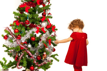 Toddler girl decorate Xmas tree