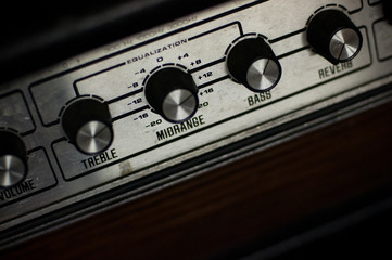 detail of guitar amplifier, knobs