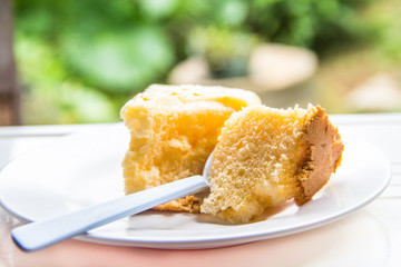 Cakes on a white dish is eaten.