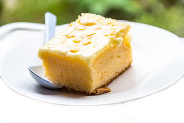 Cakes on a white dish is eaten.