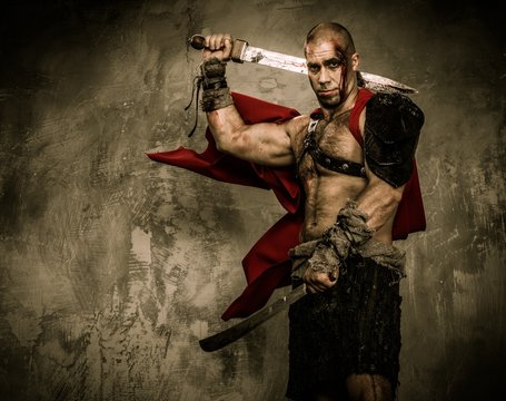 Wounded gladiator with two swords covered in blood