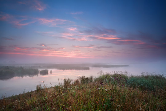 foggy sunrise over river