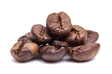 Heap of coffee beans isolated on white background