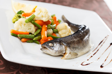 trout served with mixed vegetables