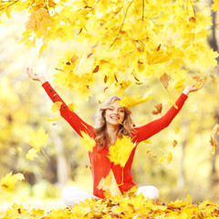 Happy woman in autumn park