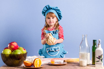 little chef works with the dough