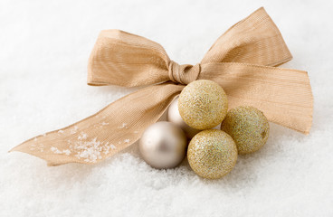 Gold Christmas baubles and ribbon