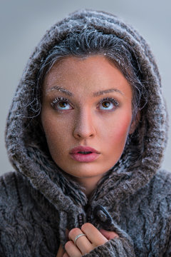 Portrait of beautiful girl with frost on face