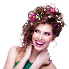 Happy young woman with flowers in her hair and bright makeup iso