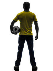 Fototapeta na wymiar rear view back man holding soccer football silhouette