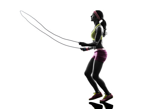woman exercising fitness jumping rope  silhouette