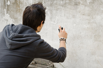 Graffiti artist holding spray can