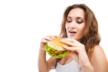 Happy Young Woman Eating big yummy Burger isolated