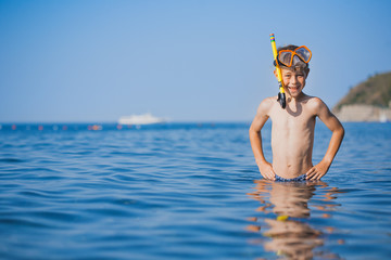 happy boy driver on the beach