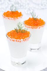 festive appetizer with cream cheese and red caviar in glass