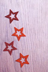 Fototapeta na wymiar christmas star shape decoration on wooden background