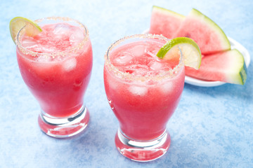 Two glasses of watermelon cocktail with brown sugar and lime