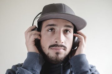 young stylish man listening to music