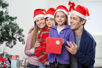 Children And Family With Christmas Gift