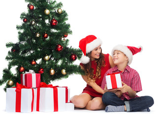 happy mother and child boy with gift boxes