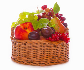 Fresh fruit basket isolated on white background. 