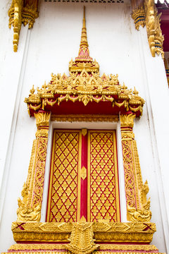 Traditional Thai style molding art on the window in Thai temple