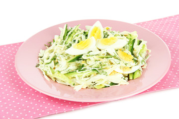 Delicious salad with eggs, cabbage and cucumbers, isolated