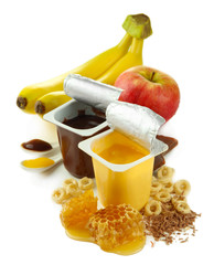 Tasty desserts in open plastic cups and honey combs, fruits,