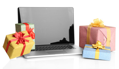 Laptop and gifts isolated on white