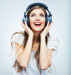 Young Happy Music woman isolated portrait. Female model studio