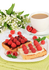 Delicious toast with raspberries on table close-up