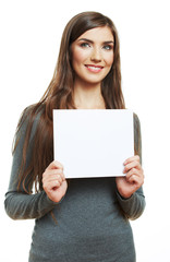 Smiling woman leaning on big blank board .