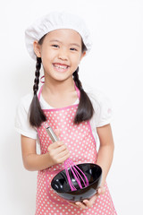 Little Asian cute chef wearing pink apron