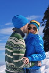 Young Couple In Winter  Snow Scene